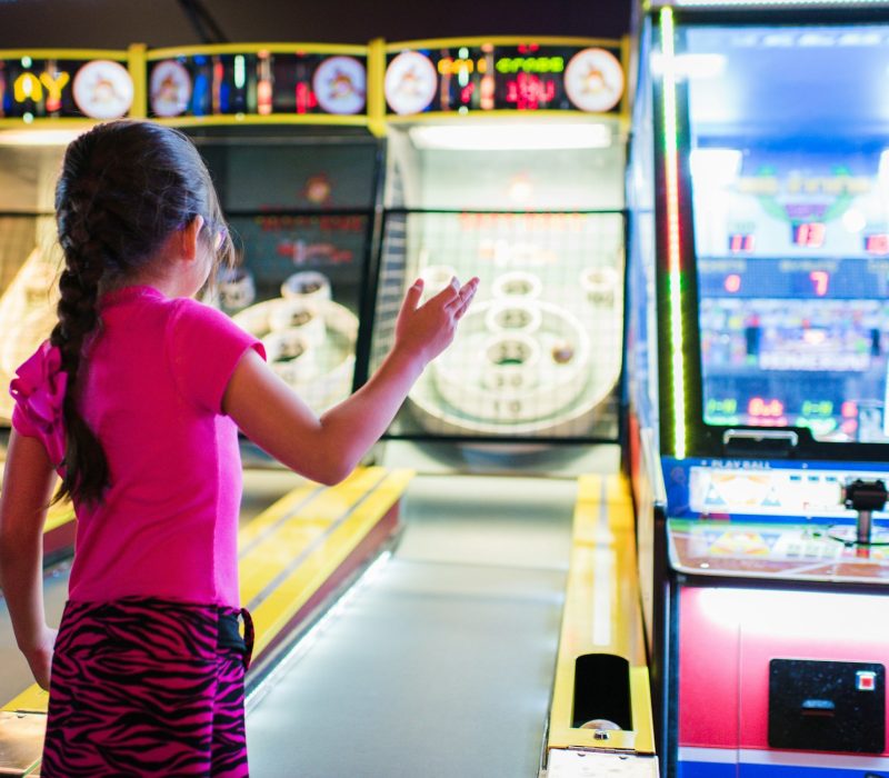 girl playing arcade games